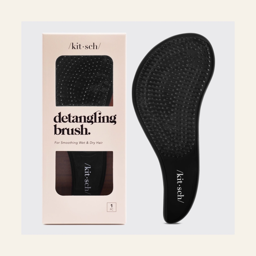 Kitsch Detangling Brush in Black beside its retail packaging