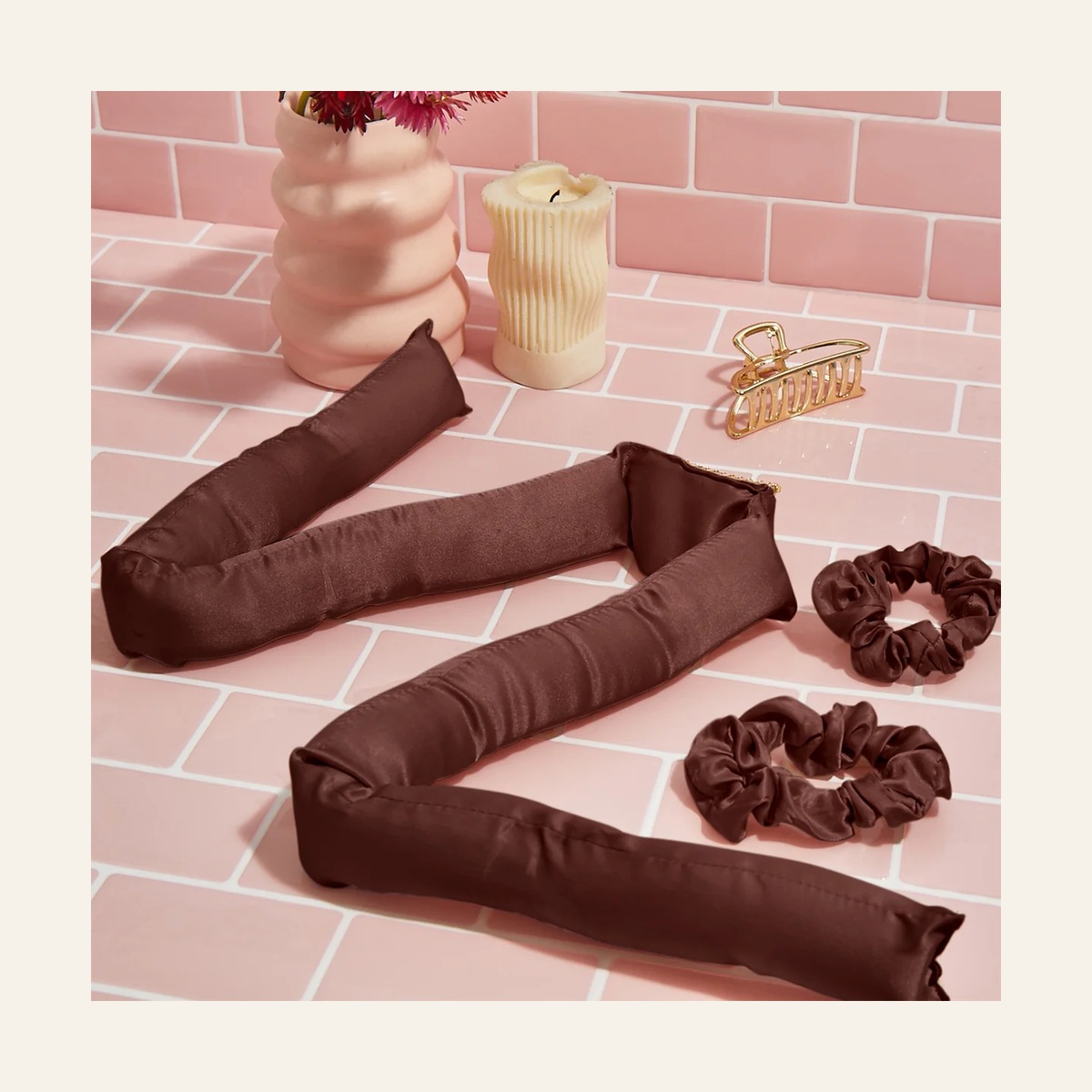 Chocolate Kitsch Satin XL rod and two matching scrunchies on a pink tiled surface