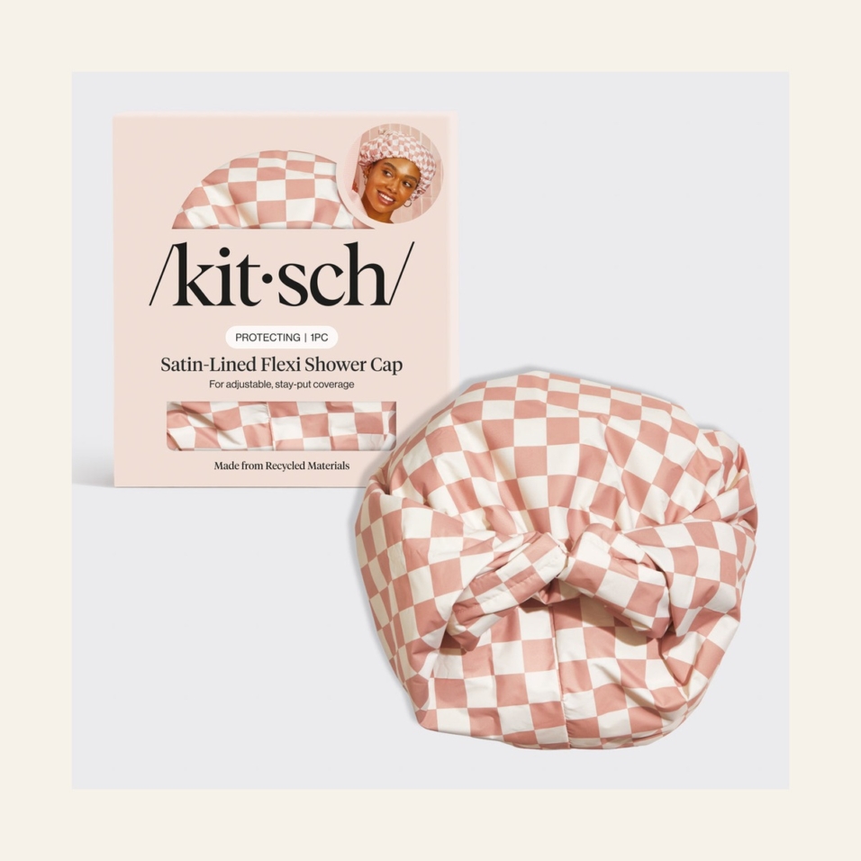 Kitsch Satin Shower Cap in Terracotta Checker beside its retail packaging