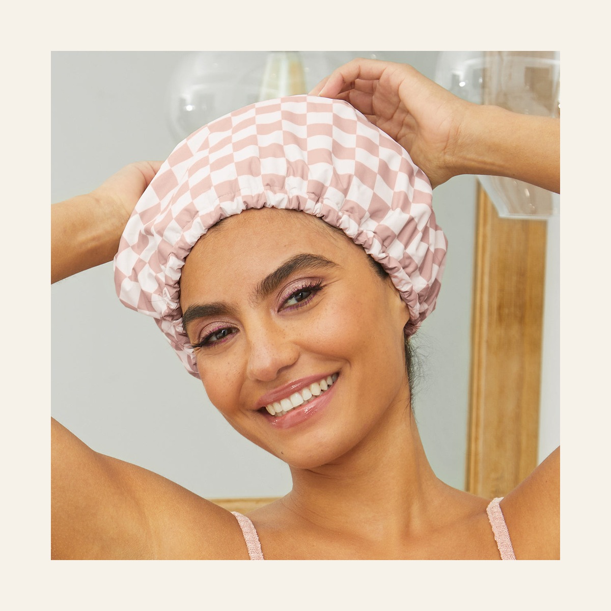 Model wearing the Terracotta Checker Kitsch Satin Shower Cap with the elastic at her hairline