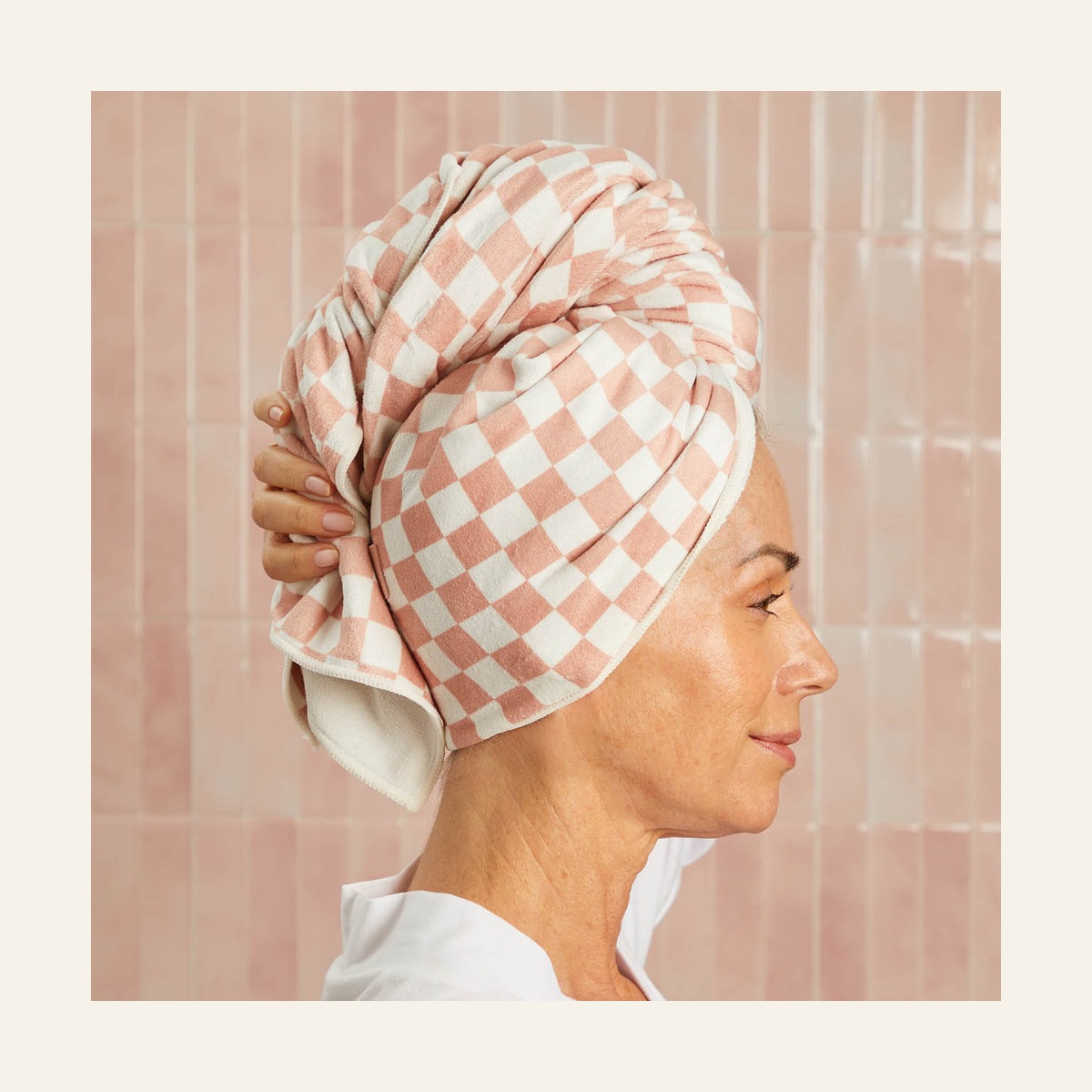 Side view of a model wearing the Terracotta Checker XL hair towel wrap