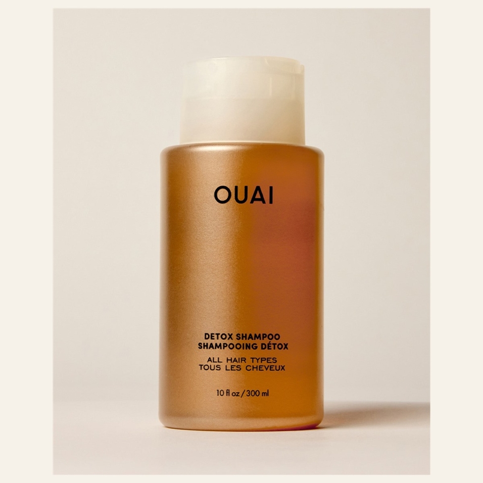 OUAI Detox Shampoo 10 fl oz / 300 ml bottle on a cream surface