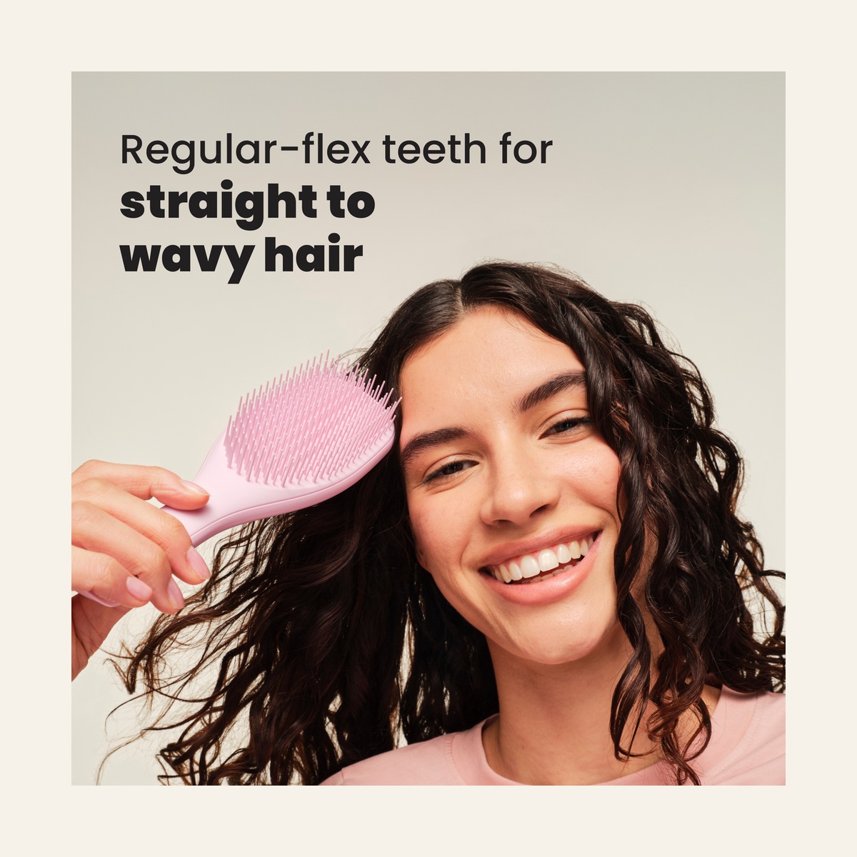 Model holding the Millennial Pink Regular Tangle Teezer Ultimate Detangler